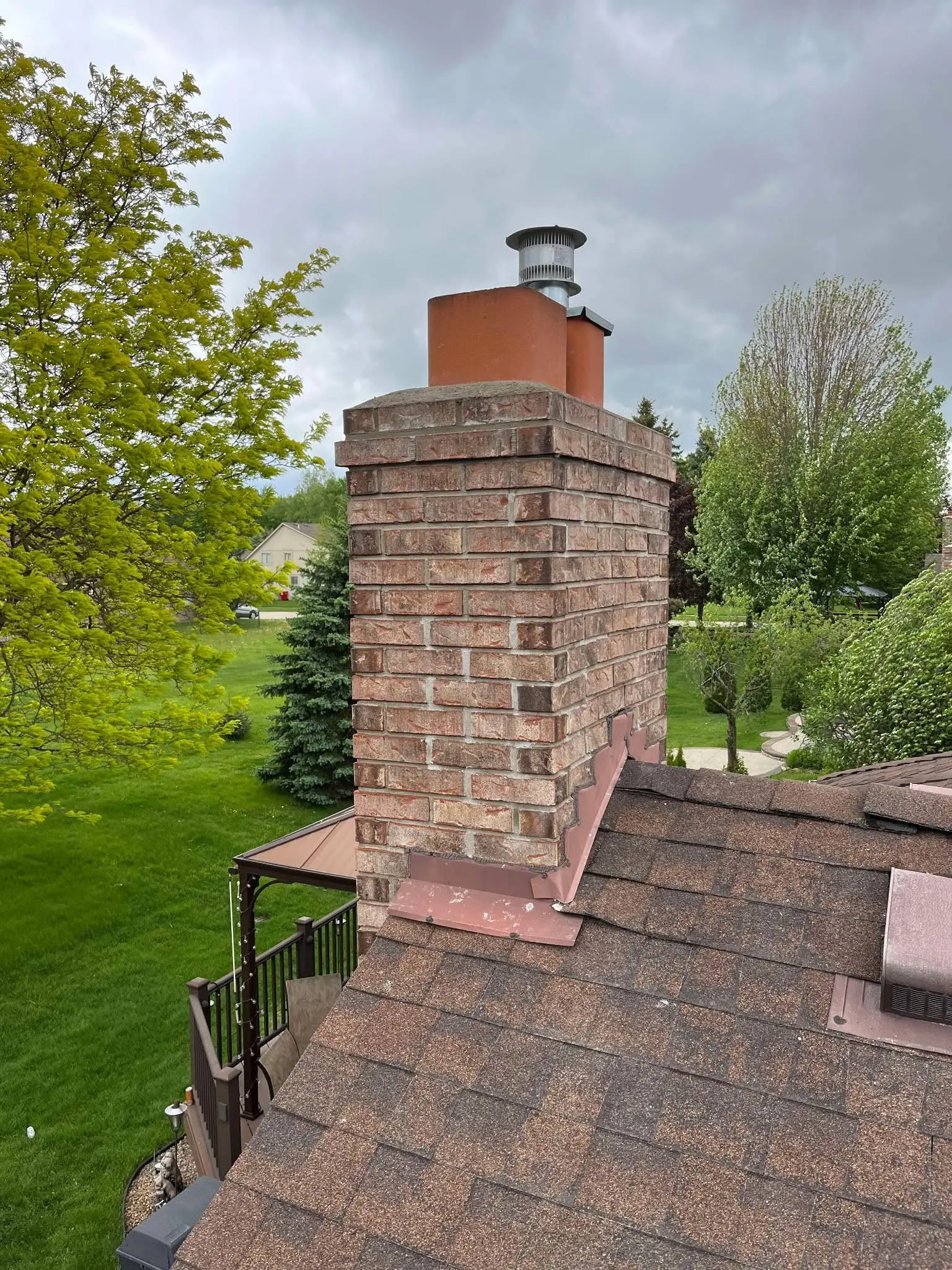Rebuilt brick chimney by Patriot Masonry